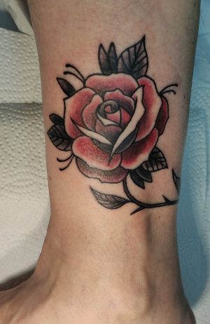 23.Traditional Rose Tattoo